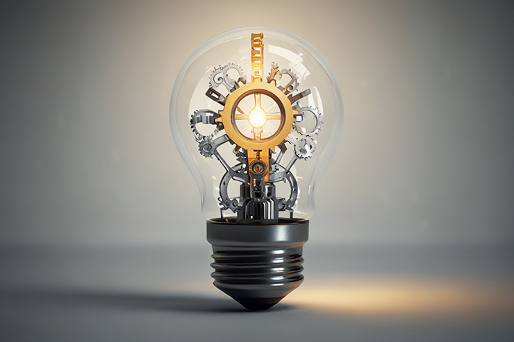 A lightbulb with gears inside, representing problem-solving and innovative thinking